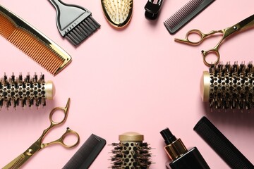 Frame made of professional hair dresser tools on pink background, flat lay. Space for text