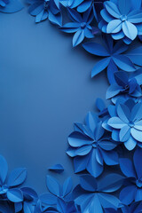 Vibrant blue paper flowers on a matching blue background. Perfect for adding a pop of color to any design project