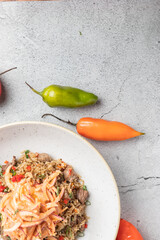 Arroz Chaufa en fondo de piedra con decoración de Ajies  Pimientos, 
