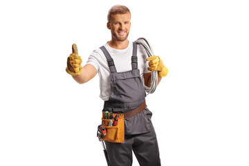Electrician in a uniform carrying cables on his shoulder and gesturing thumbs up