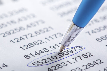 Accounting document with pen, money, coins and checking financial chart. Concept of banking,...