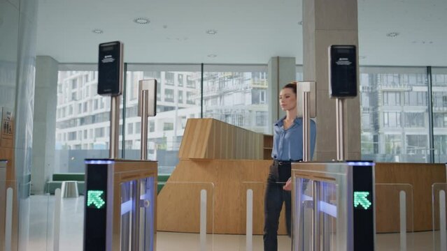 Businesswoman entering electronic gates office. Business lady putting keycard
