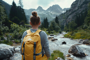 Woman admiring a mountain stream, ideal for travel blogs