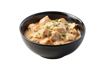 Creamy chicken in a black bowl isolated on transparent background.