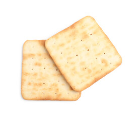 Tasty crispy square crackers isolated on white, top view