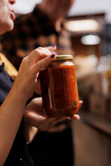 Father and daughter shopping in zero waste store looking for non GMO bulk products. Family members purchasing chemicals free pantry staples from local neighborhood shop, close up