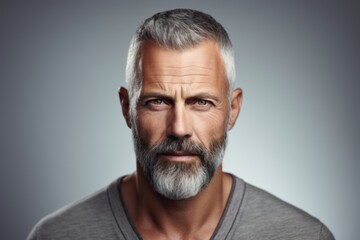 Portrait of a handsome mature man with grey beard and mustache. - obrazy, fototapety, plakaty