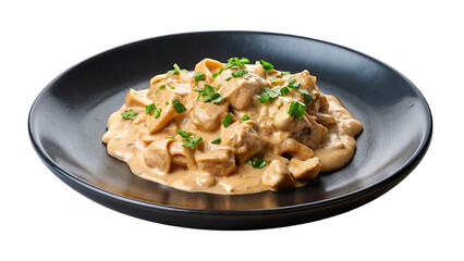 Chicken stroganoff with mushroom sauce on black plate isolated on transparent background