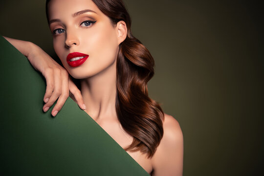 Photo of fancy luxurious passionate lady with bare shoulders nice make up hold dark green color board empty space