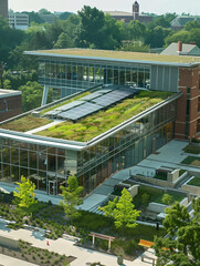 A Photo Of A Public Library With A Green Roof And Solar Panels Serving As A Community Hub For Learning And Sustainability Education
