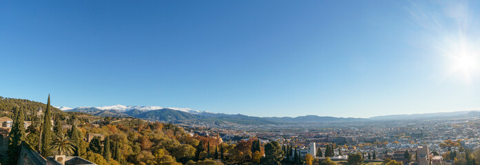 Panorama of beautiful autumn landscape of Sierra Nevada with snow capped mountains seen from the...