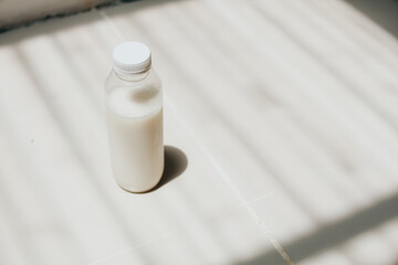 isolated white milk in the bottle with white background