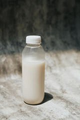 isolated white milk in the bottle with white background