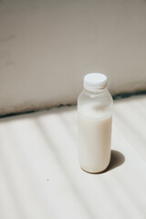 isolated white milk in the bottle with white background