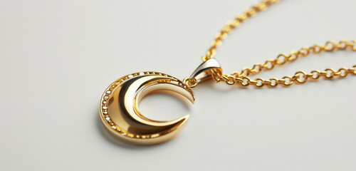 Shimmering golden chain, upright celestial pendant, on pure white.