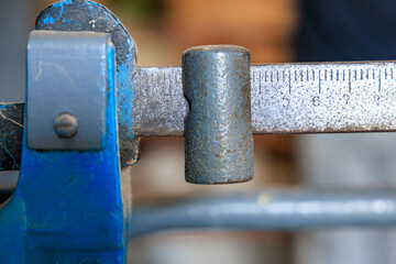 A blue scale with a ruler on it