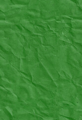 Seamless crumpled dark green kraft paper texture. Empty textured sheet. Vertical portrait orientation.