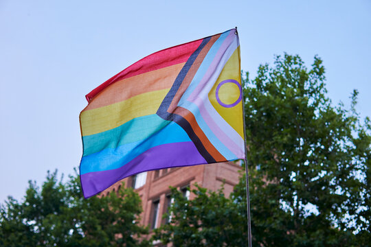 Inclusive Pride Flag Waving on a Clear Day