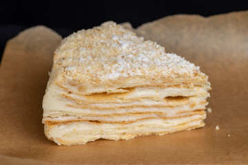 multi-layered cake made of buttercream and thin wheat cakes