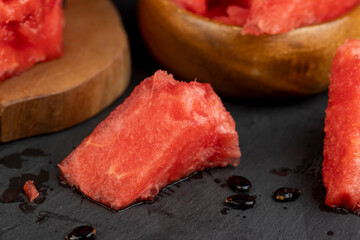 sliced into pieces of red ripe watermelon