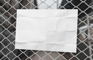 Poster texture paper mockup on wired fence