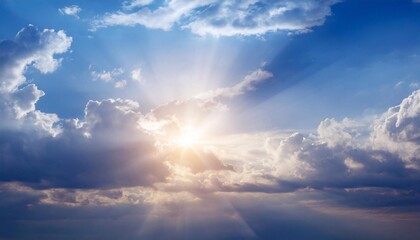 Obraz premium Blue sky with white clouds and sunbeams. Nature background.