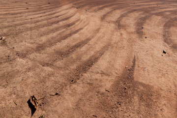 a walking red path made of rammed sand after sweeping