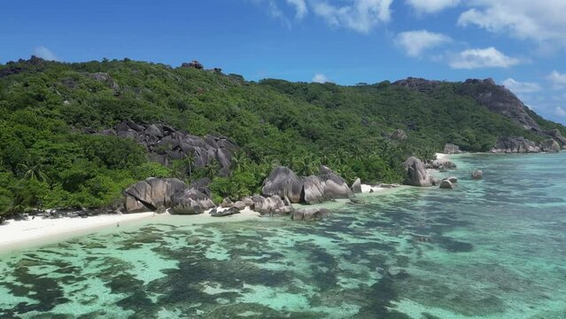 Anse Cocs beach, La Digue Seychelles, tropical beach during a luxury vacation in Seychelles. Tropical beach Anse Cocs beach, La Digue, Praslin, Mahe Seychelles with turqouse colored ocean