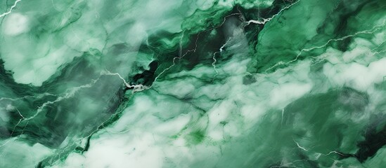 Fototapeta premium Close up of a lush green marble texture resembling a natural landscape with water, plants, grass, and fluvial landforms of streams, featuring a stream, waterfall, and rapids