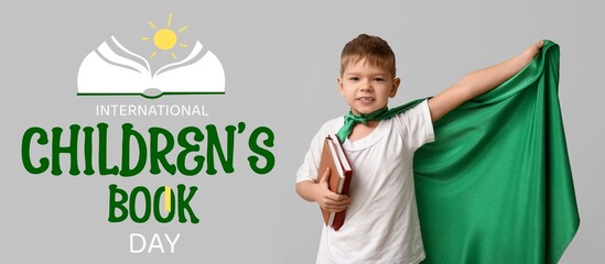Banner for International Children's Book Day with cute little boy dressed as superhero
