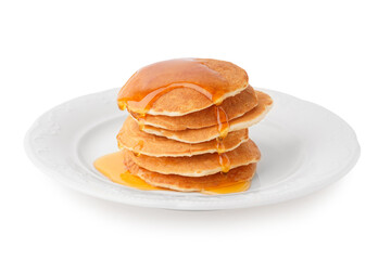 Plate of tasty pancakes with maple syrup on white background