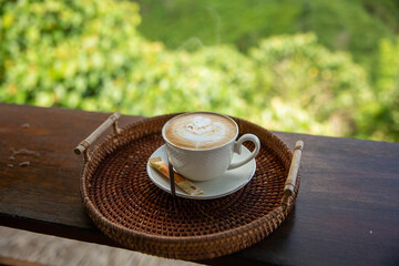 Your favorite morning cup of Cappuccino coffee by the window
