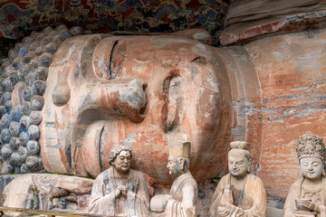 Rock sculpture of the 31m sleeping buddha statue of sakyamuni entering nirvana
