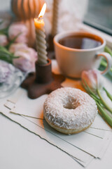 Donut and tea in a spring atmosphere
