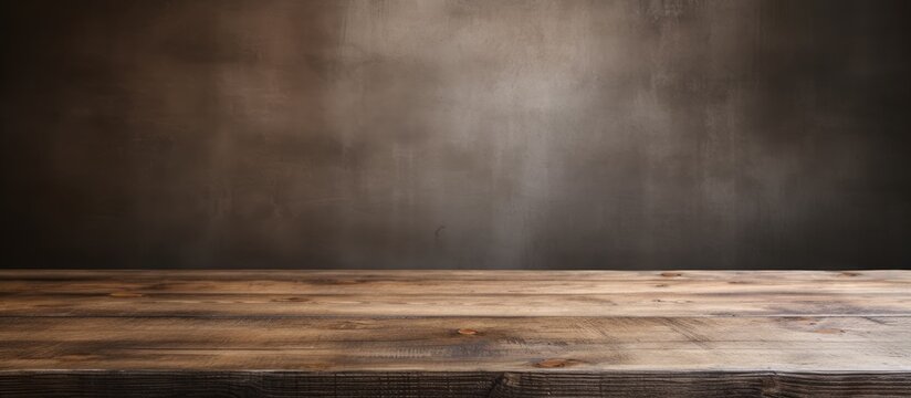 A brown hardwood table is set against a dark natural landscape wall, highlighting the tints and shades of wood. The wood stain adds depth to the cloudfilled horizon