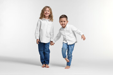 Fototapeta premium Cute little children on white background. Happy family