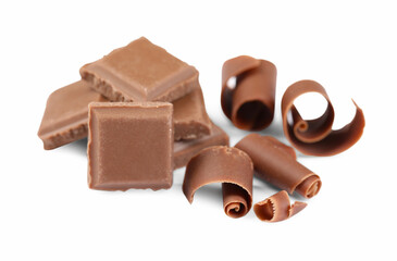 Delicious chocolate shavings and pieces isolated on white