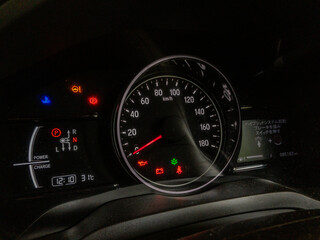 Car speedometer and instrument cluster, various warnings and lights, japanese text, hybrid car with digital displays