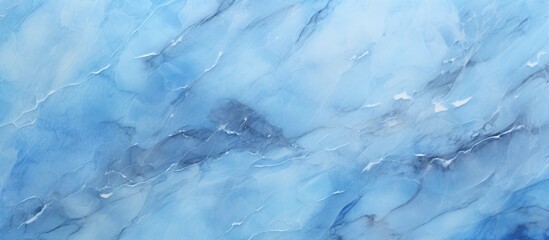 A detailed shot of a frozen blue marble texture resembling a natural landscape with a pattern of cumulus clouds, creating an electric blue effect, symbolizing the winter season