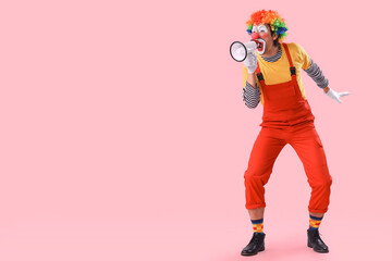Portrait of clown with megaphone on pink background. April Fool's day celebration