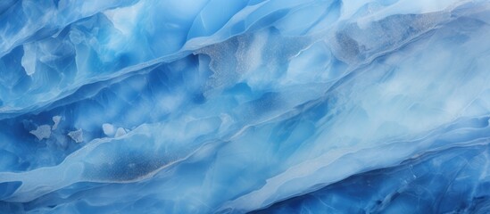 Obraz premium A close up of a natural landscape resembling a blue and white marble texture, resembling a geological phenomenon in the sky, with electric blue patterns and cumulus clouds freezing in the water