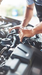 Professional technician hands conducting car repairs at an auto service workshop