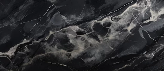 Fotobehang A closeup of a black and white marble texture resembles a cloudy sky or a geological phenomenon. The pattern creates a sense of depth and space, like a landscape or a cumulus cloud © 2rogan