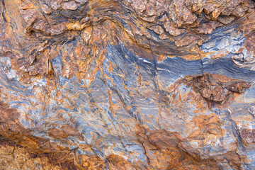 Extremely close up of an interesting shale rock texture pattern of featuring surface pattern highlights background.