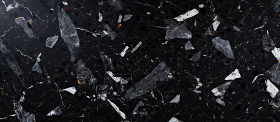 A monochrome photography of a black granite counter top with white spots, creating a striking...