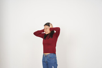 Young Asian woman in Red t-shirt Covering ears hears bothering noise isolated on white background