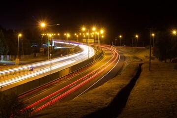 curved road with vehicle lights, long exposure, chile