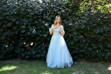 full length portrait of beautiful female model wearing blue fantasy ballgown, like a fairytale elf...