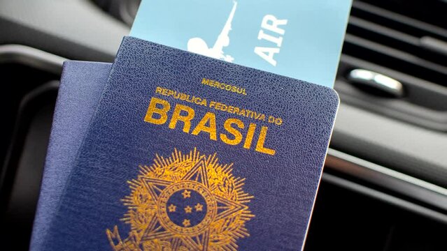 Brazilian passport highlighted on the dashboard, symbolizing travels and adventures. Exploring the world: Brazilian passport featured on the vehicle's dashboard.