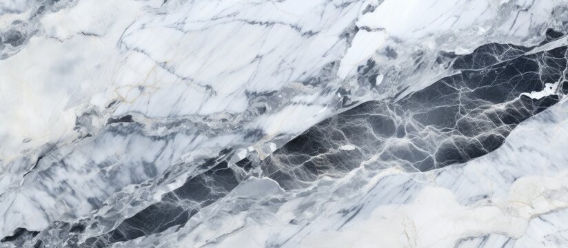 A detailed shot capturing the fluid pattern of a white and black marble texture, resembling the movement of water, wind waves, or snow in a landscape